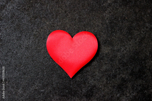 St. Valentine day background. Red heart on dark background