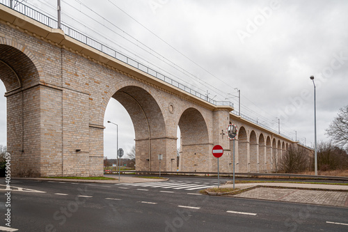 Rail viaduct over valley with river Bobr in Boleslawiec, Poland. Entirely built of stone in 1846. One of the longest masonry bridges of its type in Europe.   photo