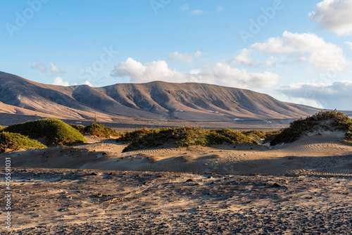 Arid hill in a desert landscape next to Famara beach in the north of the island of Lanzarote