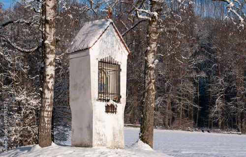 a wayside shrine in southern germany on a sunny winter day