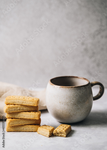 Scandinavian mug with pile of shortbread biscuits