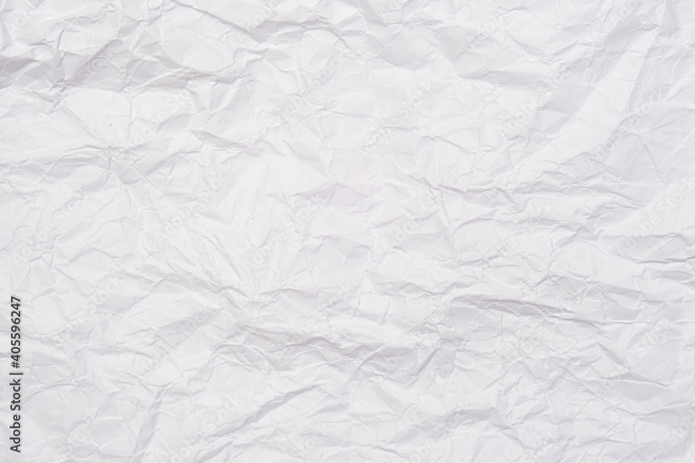 A background of sheet of white crumpled paper with wrinkles, backdrop for design and web A background of sheet of white crumpled paper with wrinkles, backdrop for design and web
