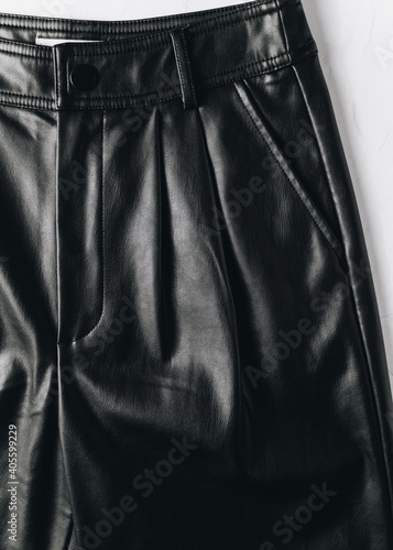 Close up of black leather trousers