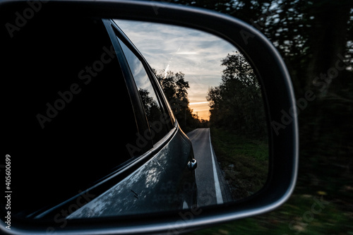 driving on the road looking out the side mirror