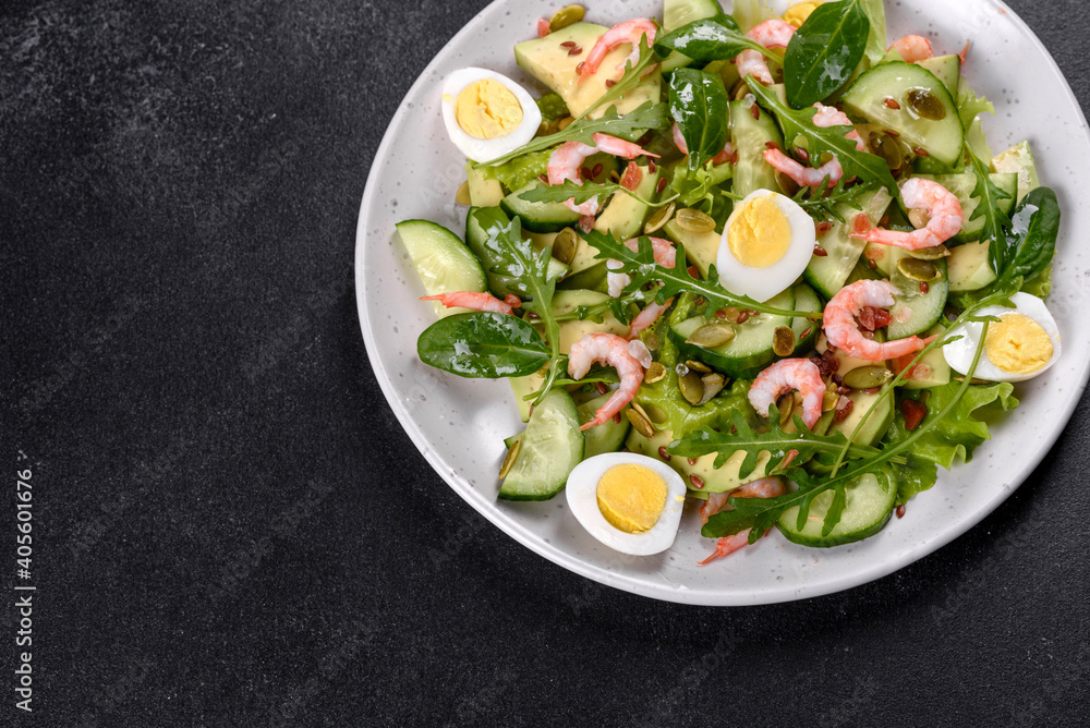 Salad with shrimp, avocado, cucumber, pumpkin seeds and flax seeds with olive oil Salad with shrimp, avocado, cucumber, pumpkin seeds and flax seeds with olive oil