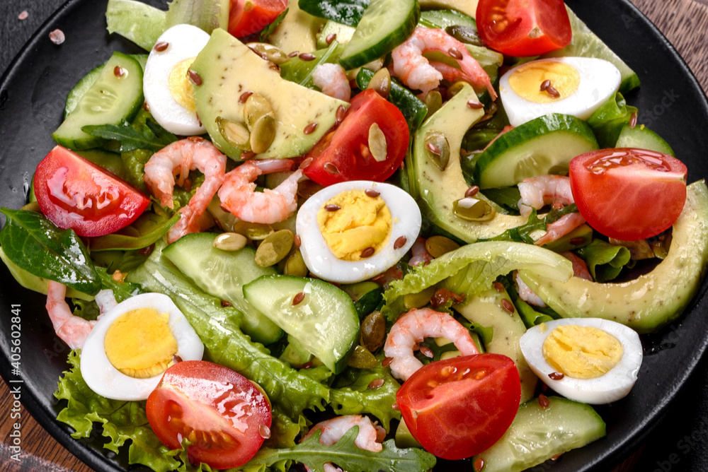 Salad with shrimp, avocado, cucumber, pumpkin seeds and flax seeds with olive oil Salad with shrimp, avocado, cucumber, pumpkin seeds and flax seeds with olive oil