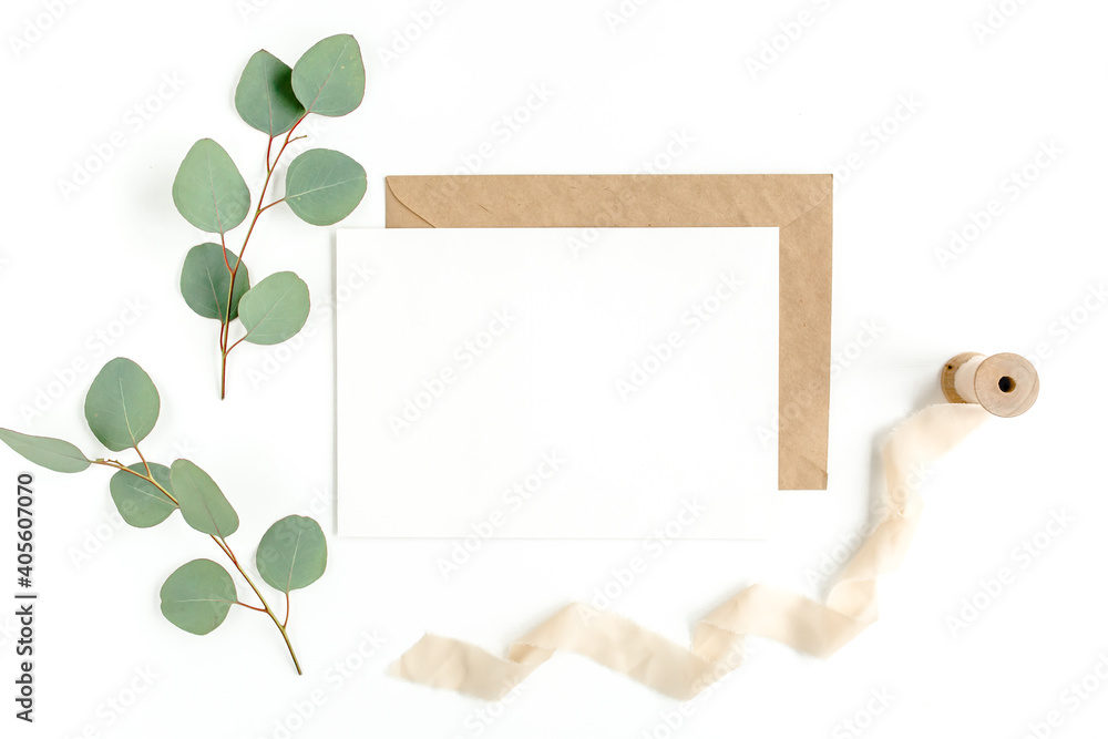Mockup invitation, blank greeting card and green leaves eucalyptus. Flat lay, top view. Mockup invitation, blank greeting card and green leaves eucalyptus. Flat lay, top view.