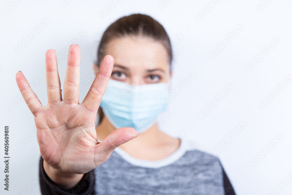 Girl stoping with hand. Keep the distance. Safe distance during a pandemic Girl stoping with hand. Keep the distance. Safe distance during a pandemic