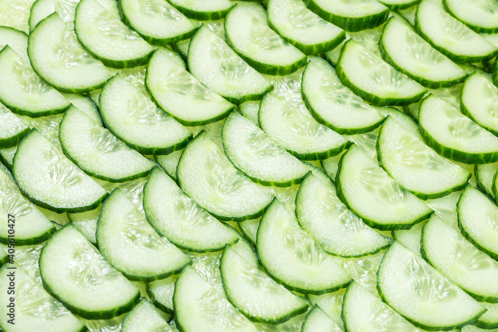 Fresh green slices of cucumber as background. Fresh green slices of cucumber as background.