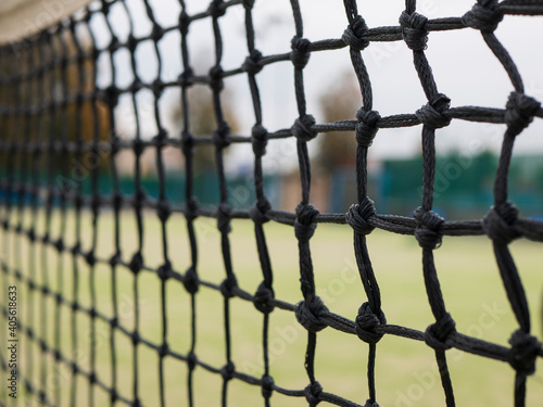 Tennis net with bokeh effect. Concept of strength, separation and ball games
