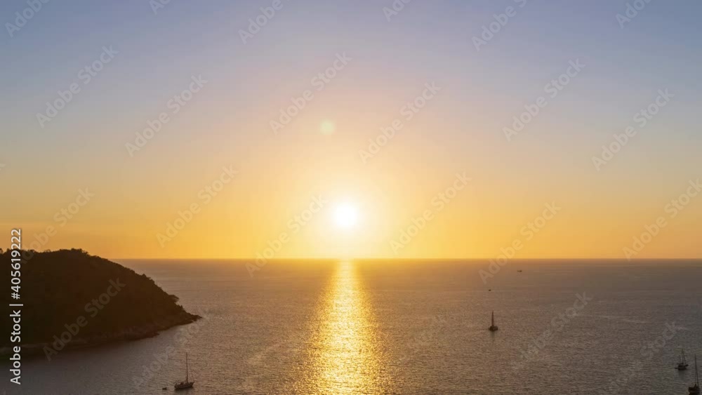 Beautiful sunset on Andaman sea at Windmill View Point near Laem Promthep Cape, Phuket, Thailand - Time Lapse Beautiful sunset on Andaman sea at Windmill View Point near Laem Promthep Cape, Phuket, Thailand - Time Lapse