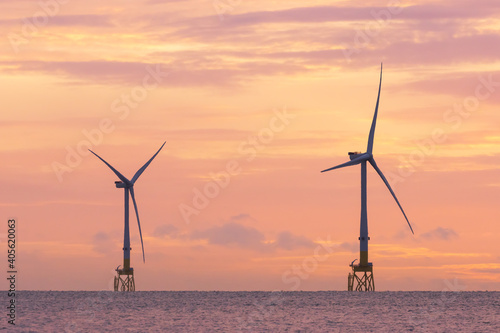 Offshore wind turbines at sunrise