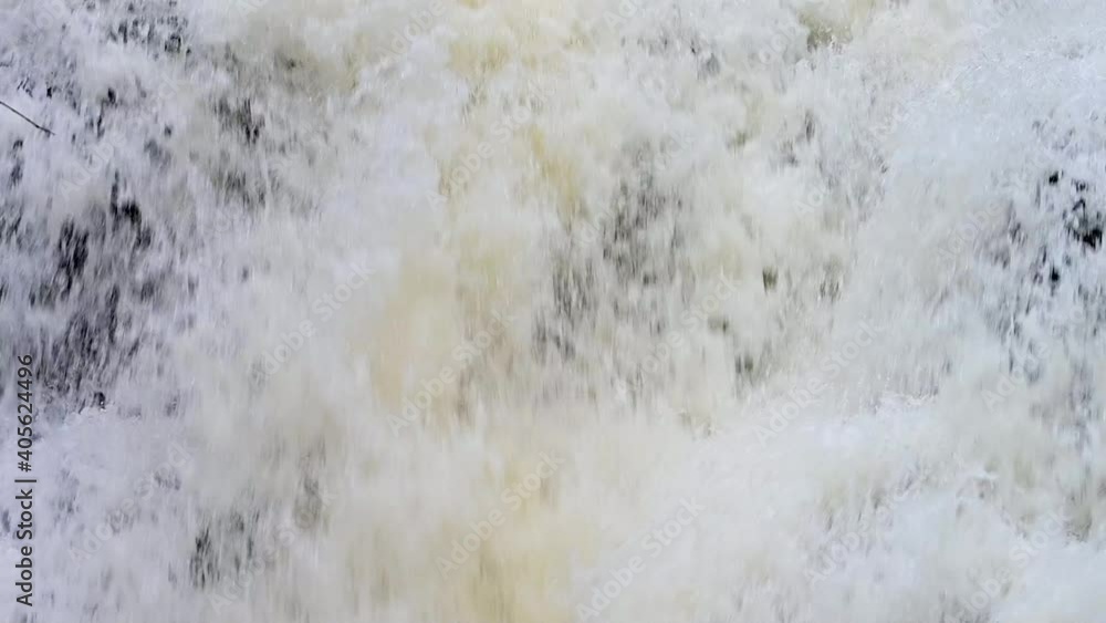 Fast flowing winter waterfall slow motion Fast flowing winter waterfall slow motion