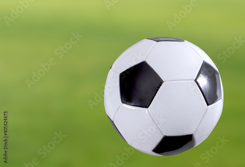 soccer ball on green grass © izzetugutmen