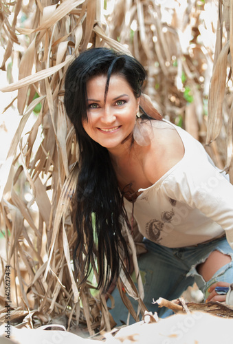 lauthing girl posing in bananas plantation. Israel. beauty and natural concept photo