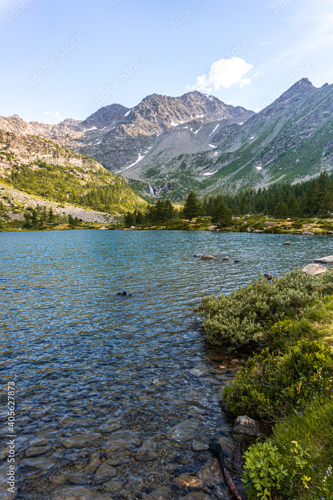 The nature and landscape of the alps seen from the shores of Lake Arpy, in the Aosta Valley, near the town of La Thuile, Italy - August 2020.