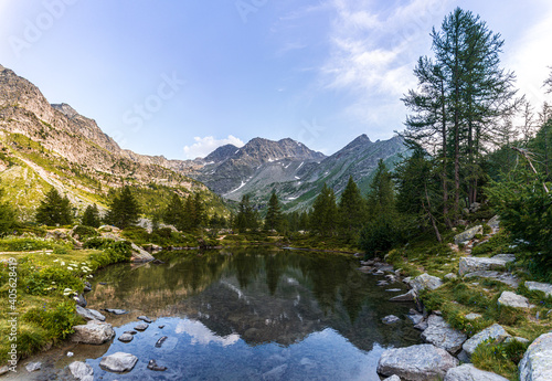 Fototapeta Naklejka Na Ścianę i Meble -  The nature and landscape of the alps seen from the shores of Lake Arpy, in the Aosta Valley, near the town of La Thuile, Italy - August 2020.