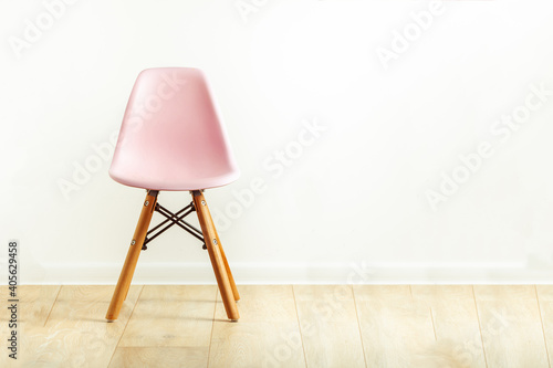  Modern chair with wooden legs on white background
