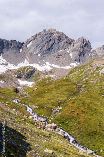 The mountains, meadows and lakes of the Aosta Valley near the town of La Thuile, Italy - August 2020.