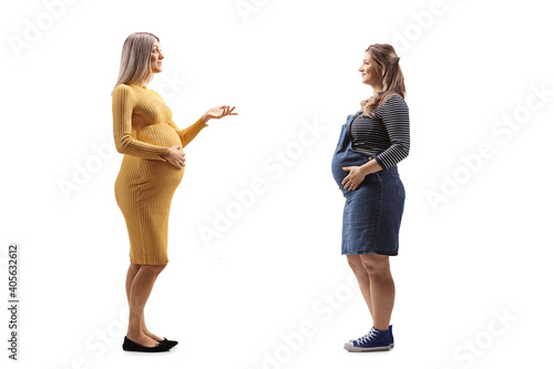Two pregnant women talking to eachother