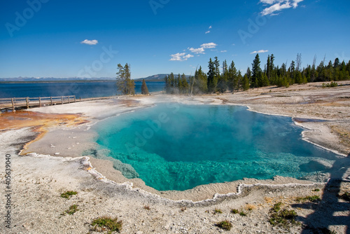 Deep azure waters of the Black Pool, a geothermal pool next to Yellowstone Lake