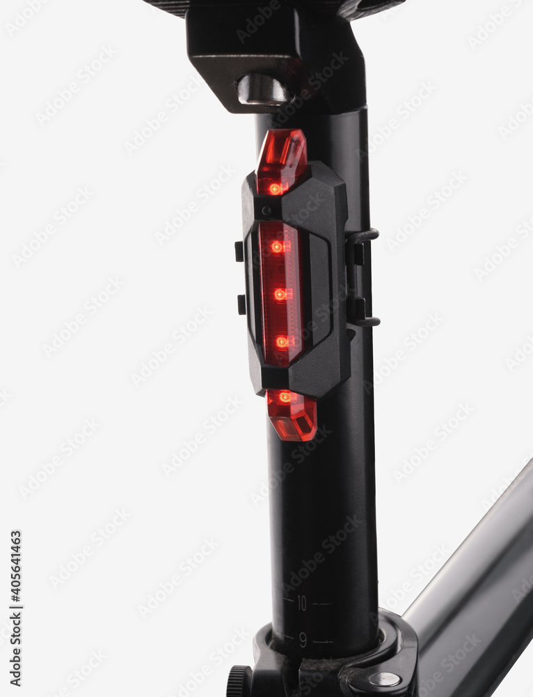 Rear bicycle flashing red light on white background Rear bicycle flashing red light on white background
