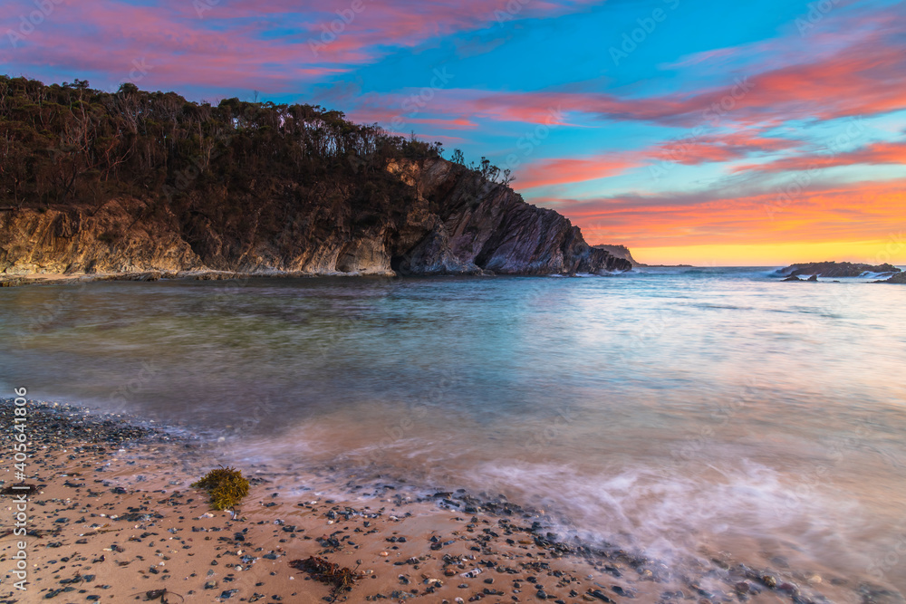 Colourful High Cloud Sunrise Seascape and Rock Formations