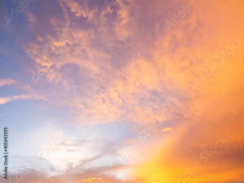 photography of sunset sky  abstract golden yellow sky  sunrise morning over clouds. skies covered colorful light rays shine through clouds. sunbeam flare spreading on beautiful nature dawnlight.