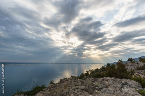 The sun's rays passing through clouds over the croatian sea