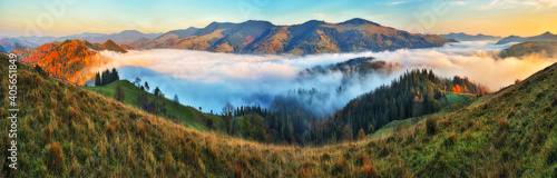 Majestic autumn rural scenery. Landscape with mountains with morning fog