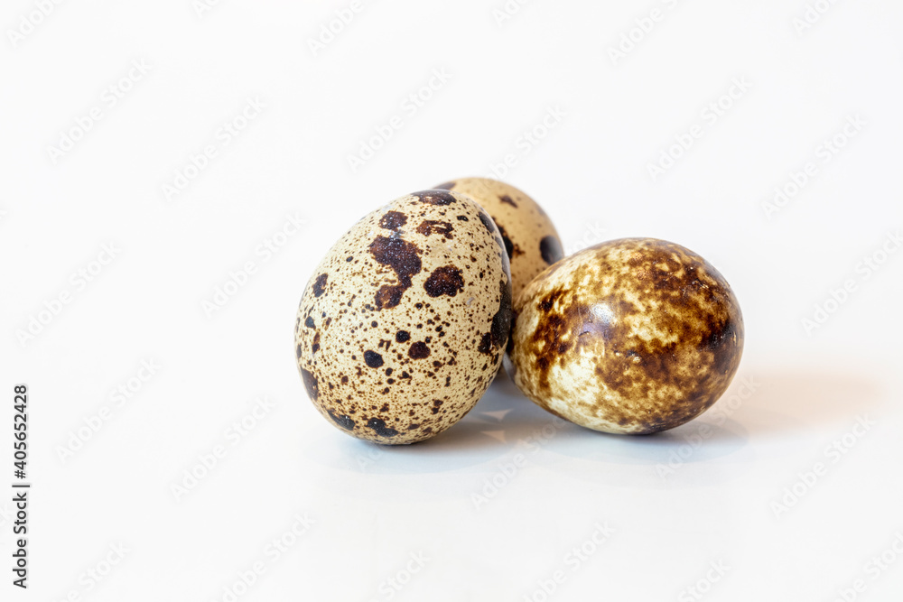 Grouping of Three Spotted Quail Eggs on a Kitchen Counter Top Grouping of Three Spotted Quail Eggs on a Kitchen Counter Top