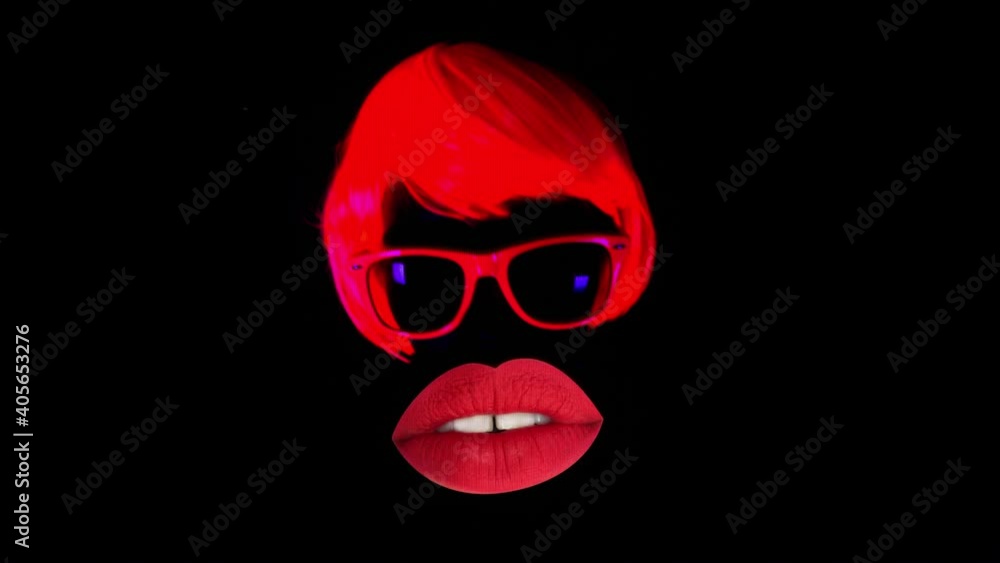 Woman with oversized red lips and hair talking against black background Woman with oversized red lips and hair talking against black background