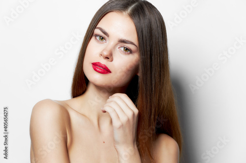 Woman tilted her head towards the shadow on her eyelids portrait charming look background