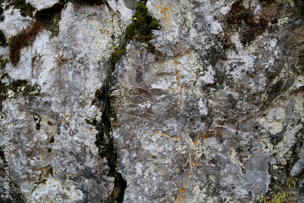 The texture of the rock. Mountain cliff of rock surface. Natural cave wall. The texture of the rock. Mountain cliff of rock surface. Natural cave wall.