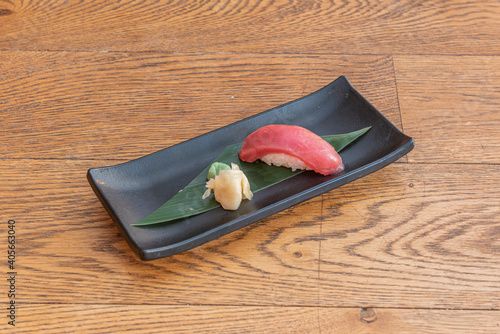 tuna nigiri on banana leaf photo