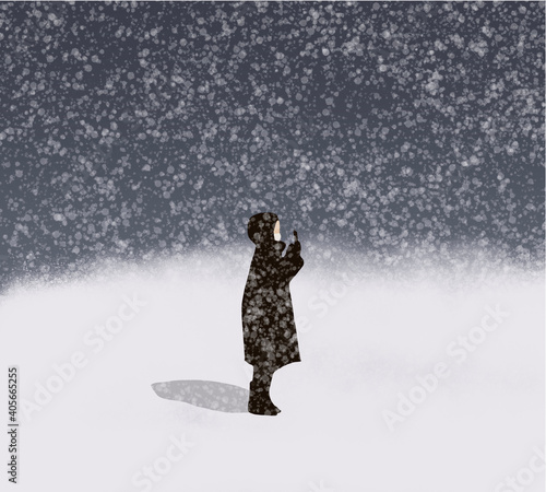 Man holding a mobile phone with medical protective face mask on his face in snowfall winter season, Covid-19 coronavirus pandemic, virus protection.