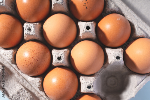 Close up top view on fresh organic chicken eggs in cardboard box photo