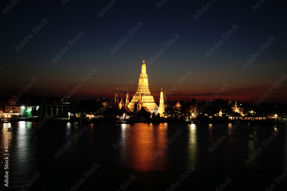 Wat arun and Chao Phraya river at twilight time. Wat Arun is a Buddhist temple in Bangkok Yai district of Bangkok, Thailand, Wat Arun is among the best known of Thailand's landmarks.