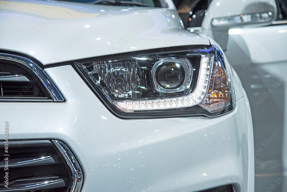 Headlight of a modern luxury car, auto detail,car care concept ,daytime running light Headlight of a modern luxury car, auto detail,car care concept ,daytime running light
