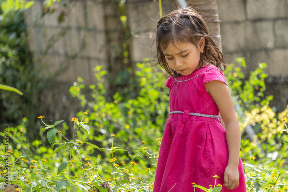 Girl in pink dress and little black eyes very expressive Girl in pink dress and little black eyes very expressive