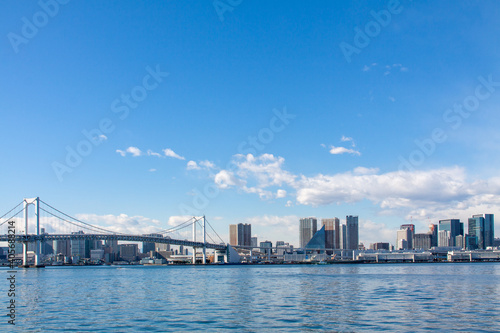 Tokyo cityscape with the rainbow bridge against the blue sky