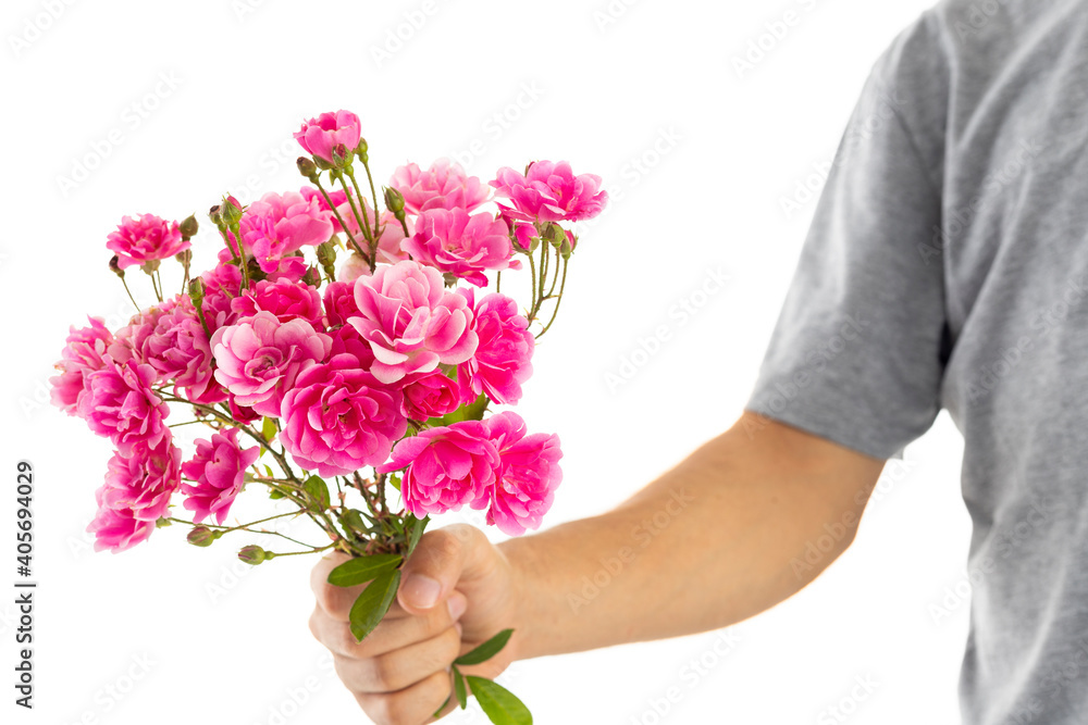 man with flowers on his hands from valentines day gift to girlfriend
