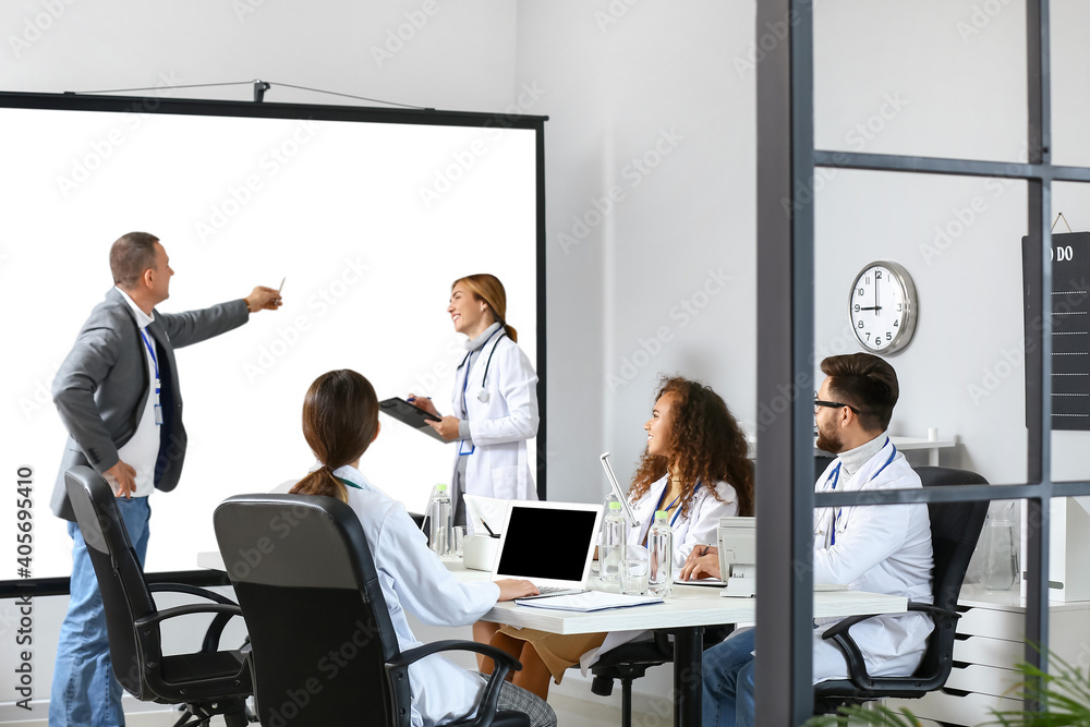Team of doctors during meeting in modern clinic Team of doctors during meeting in modern clinic