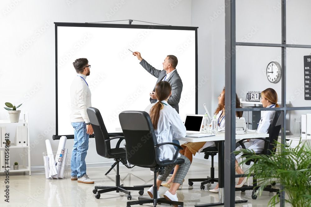 Team of doctors during meeting in modern clinic Team of doctors during meeting in modern clinic