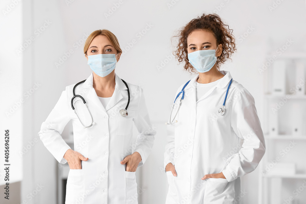 Portrait of female doctors wearing medical masks in clinic Portrait of female doctors wearing medical masks in clinic