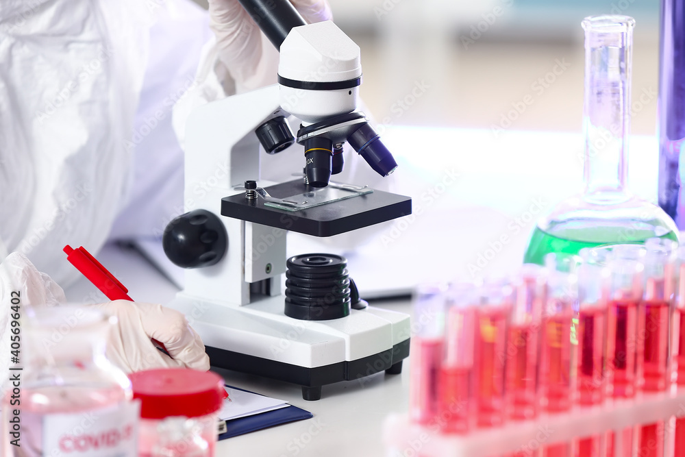 Scientist studying sample in laboratory Scientist studying sample in laboratory
