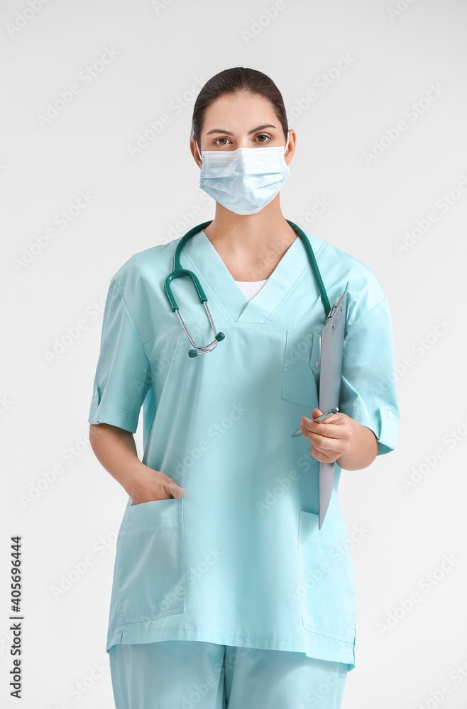 Portrait of female doctor on light background Portrait of female doctor on light background