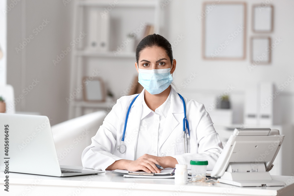 Portrait of female doctor wearing medical mask in clinic Portrait of female doctor wearing medical mask in clinic