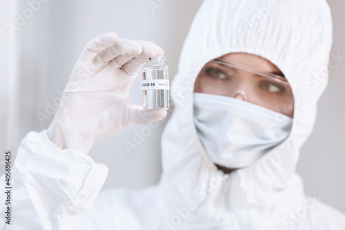 Scientist with covid-19 vac...