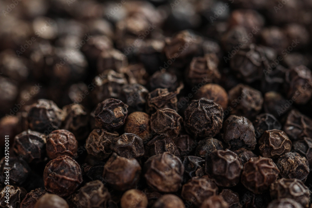 Black pepper seeds. Closeup of lots of dried black peppercorns. Black pepper seeds. Closeup of lots of dried black peppercorns.